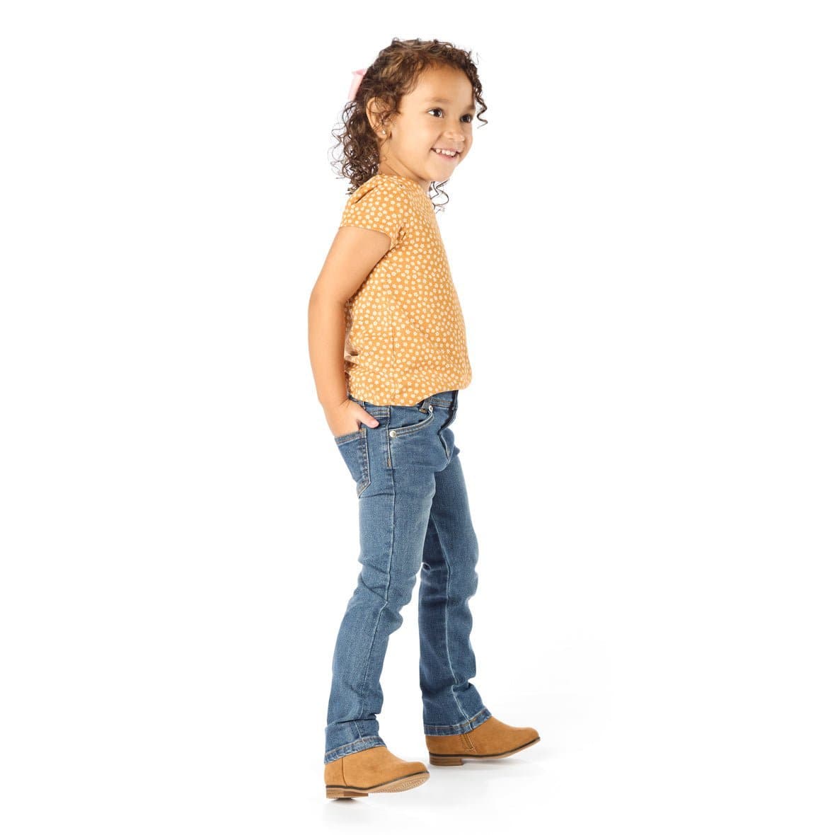 Thin Little Girl Wearing Slim-Fit Kids Jeans with Hands in her Back Pockets
